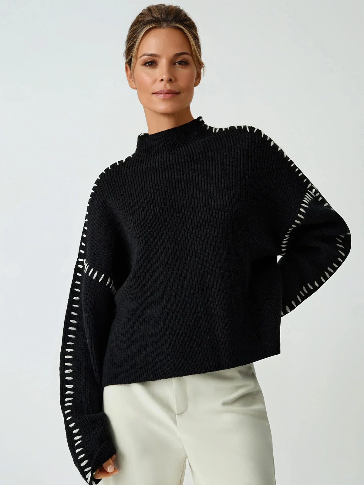 Clemence black contrast-stitch mock-neck sweater, front view
