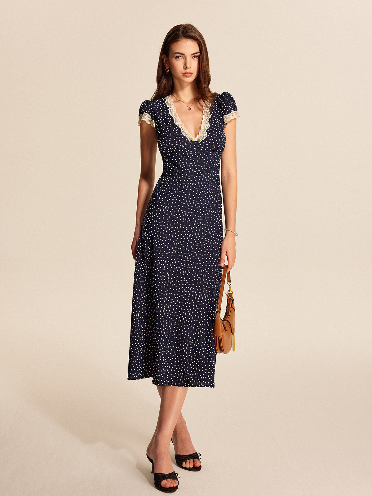 Blue short-sleeve ruched midi dress, side view