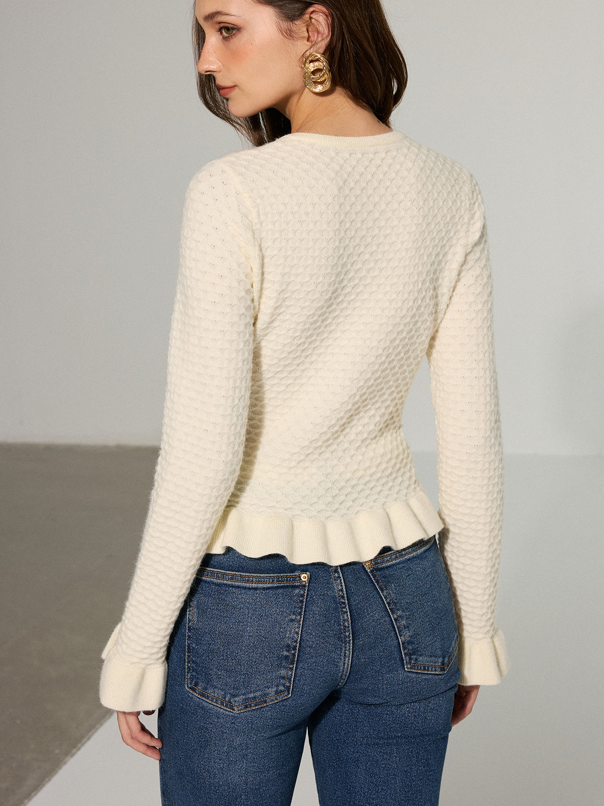 Colombe cream cardigan, close-up of the peplum ruffle at the waist