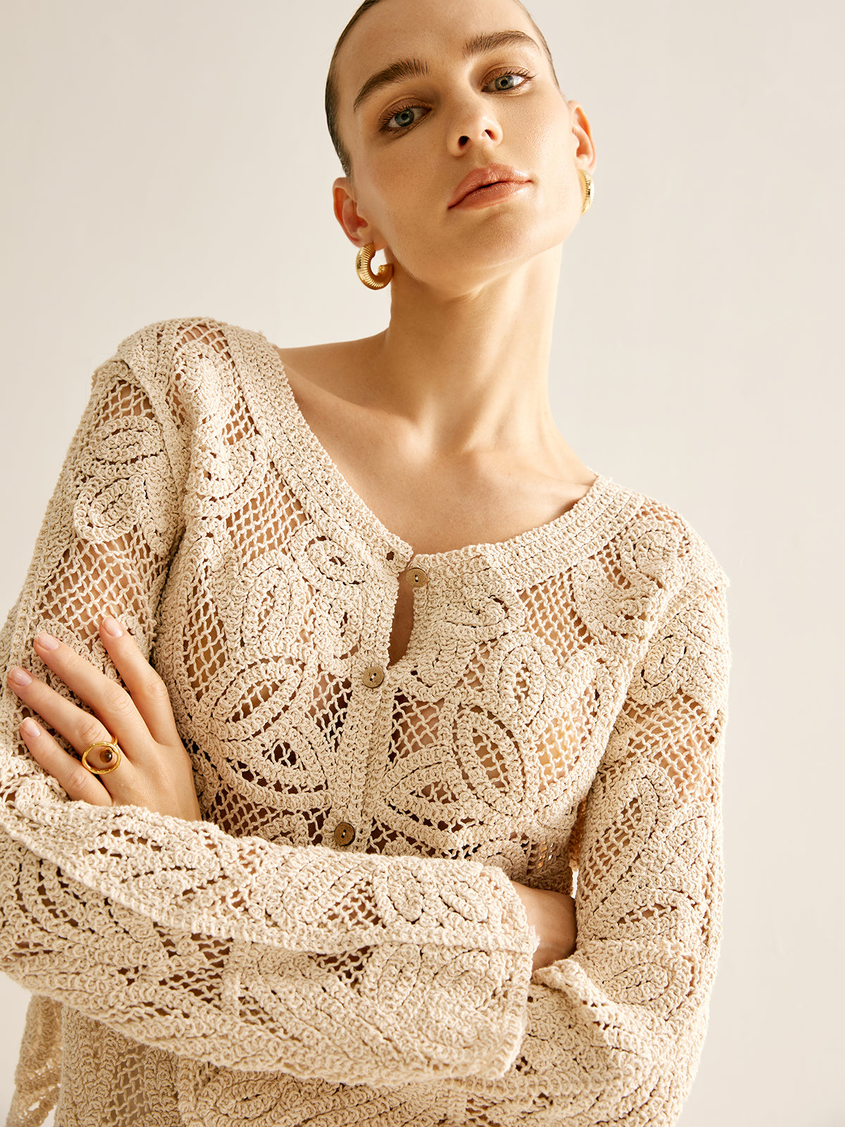 Cosette beige crochet openwork cardigan, close view of the neckline and cuff