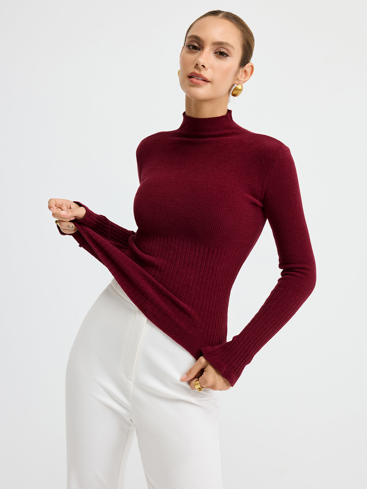Danielle burgundy ribbed mock neck top, close-up of the ribbed waist band and bell cuffs