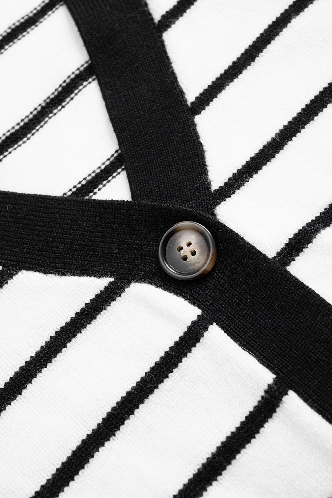 Denise Breton stripe cardigan, close-up of the black-bound V-neck and button