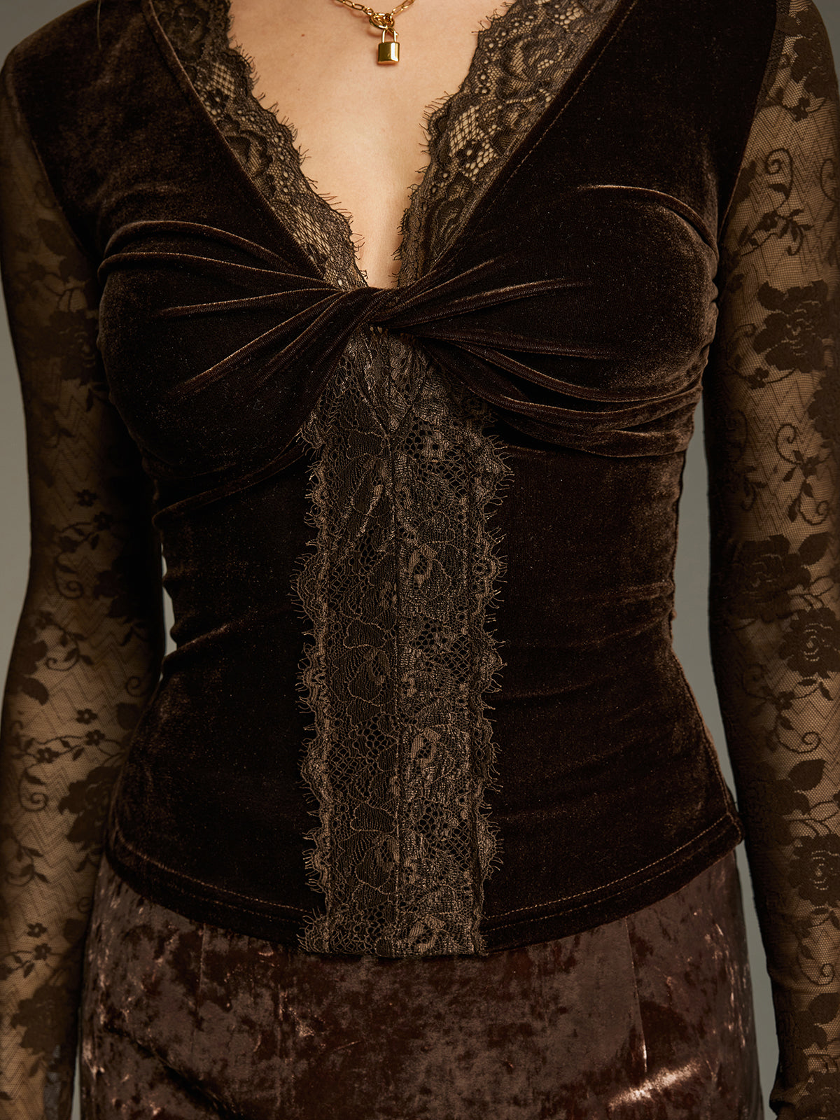 Desiree brown velvet lace twist front V-neck blouse, close-up of the twist knot and center lace panel