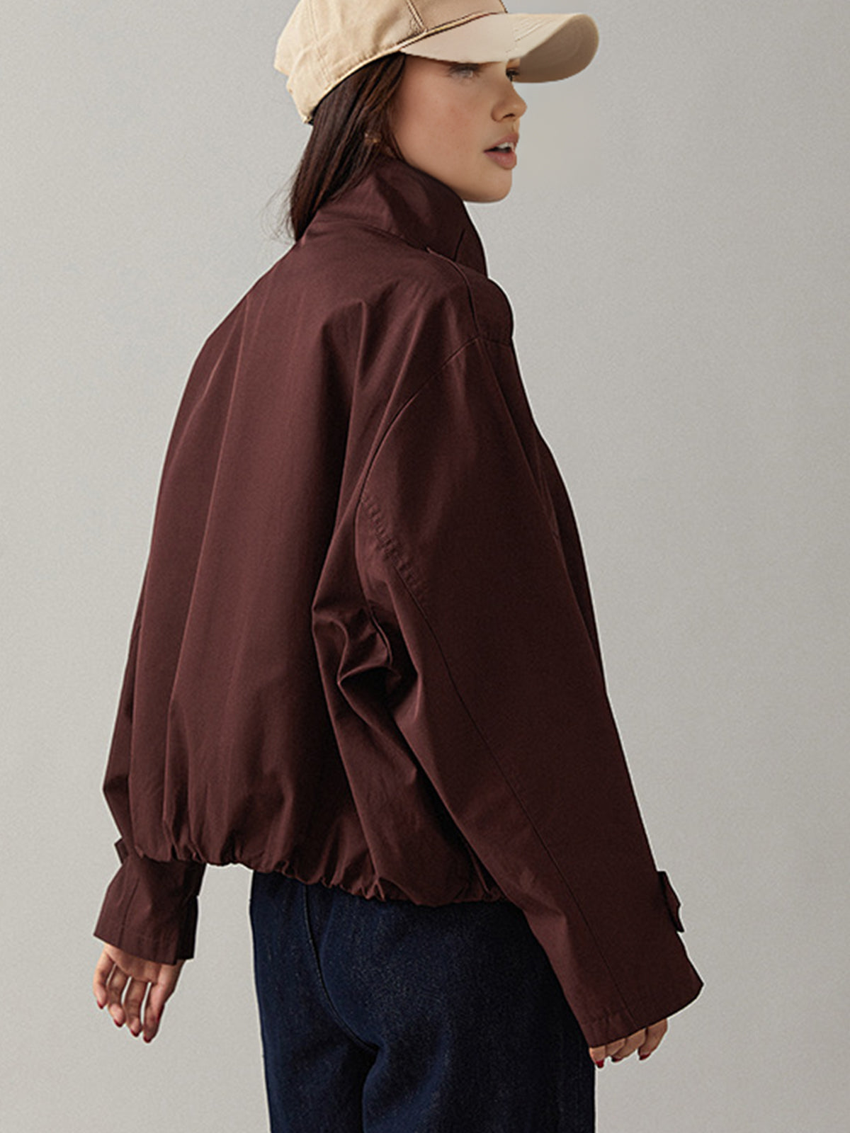 Edmee Maroon cropped jacket, back view with the collar worn standing