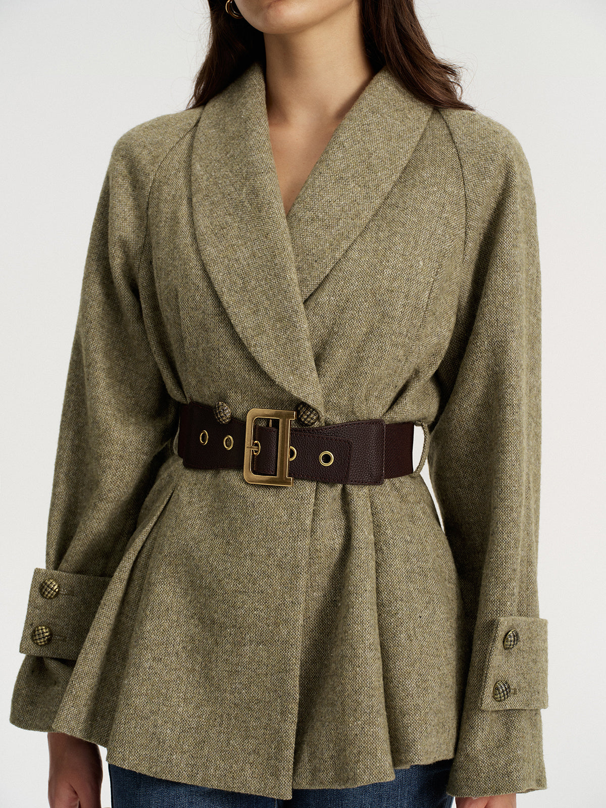 Emilienne green belted wool-blend jacket, close crop on shawl collar, belt buckle and cuff button tabs