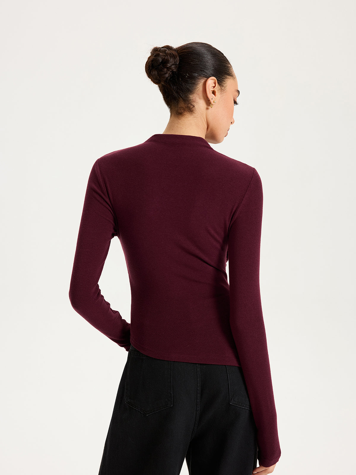 Emmanuelle burgundy draped crossover ruched knit top, back view with the stand-up neck band