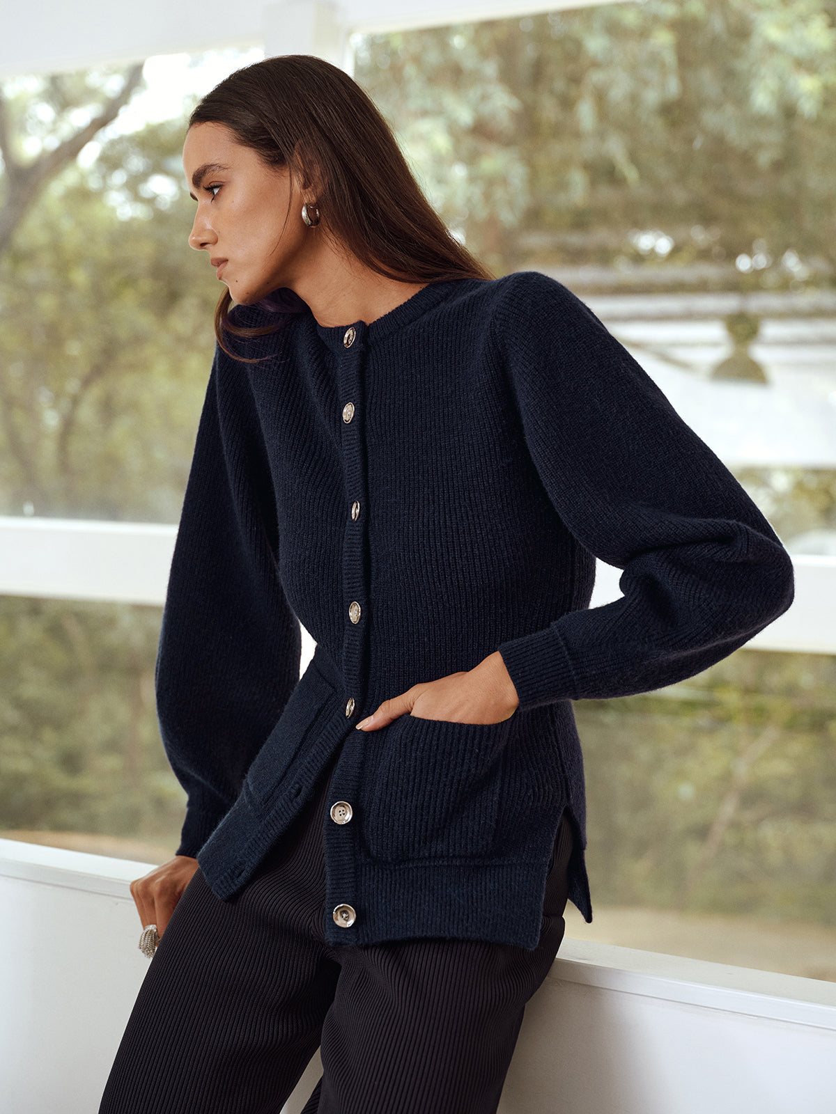 Ernestine navy cardigan showing the patch pocket at the hip