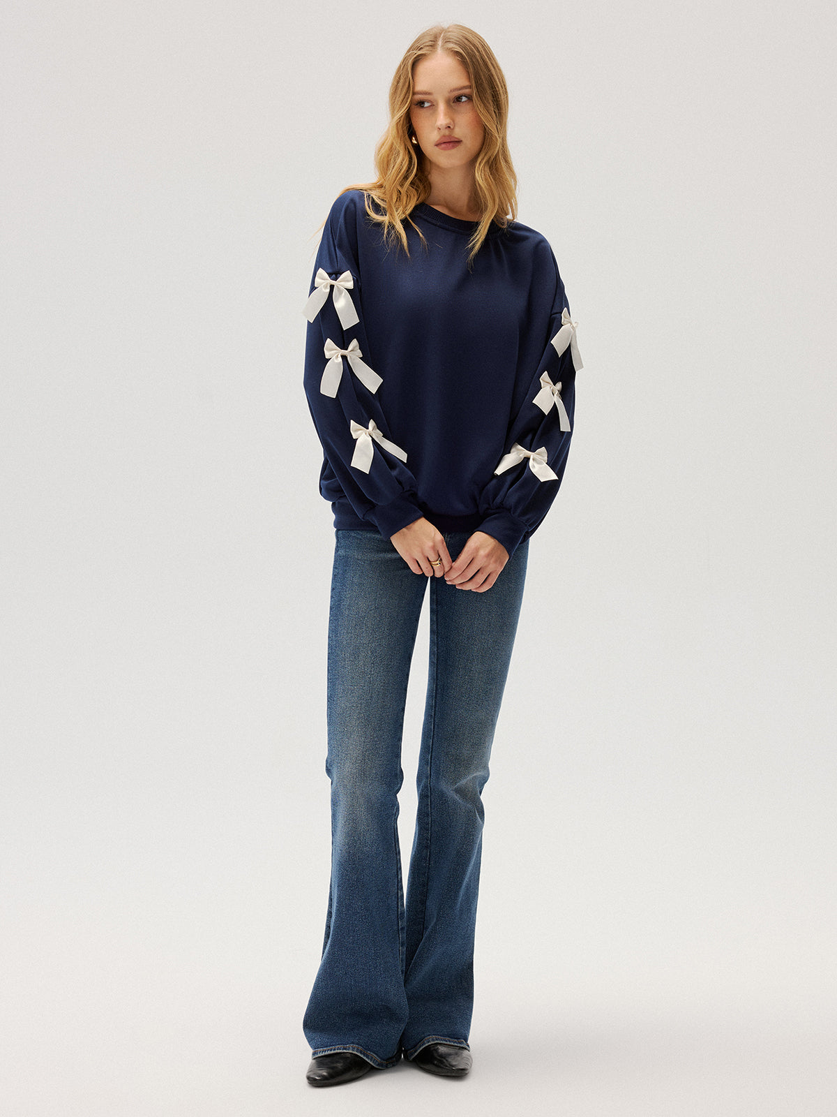 Evelyne navy ribbon bow sleeve sweatshirt, full-length front view