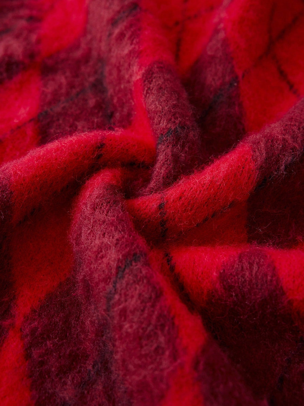 Close-up of the brushed red yarn on the Faustine sweater