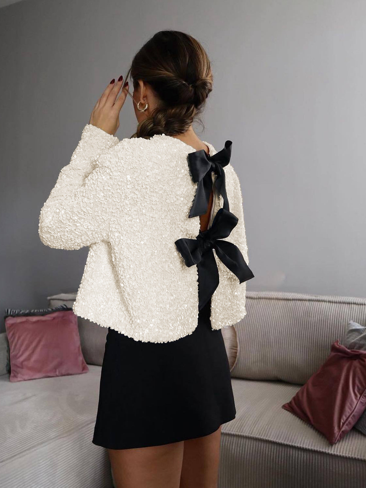 Fernande Cream sequin cropped jacket styled with the bow opening worn at the back
