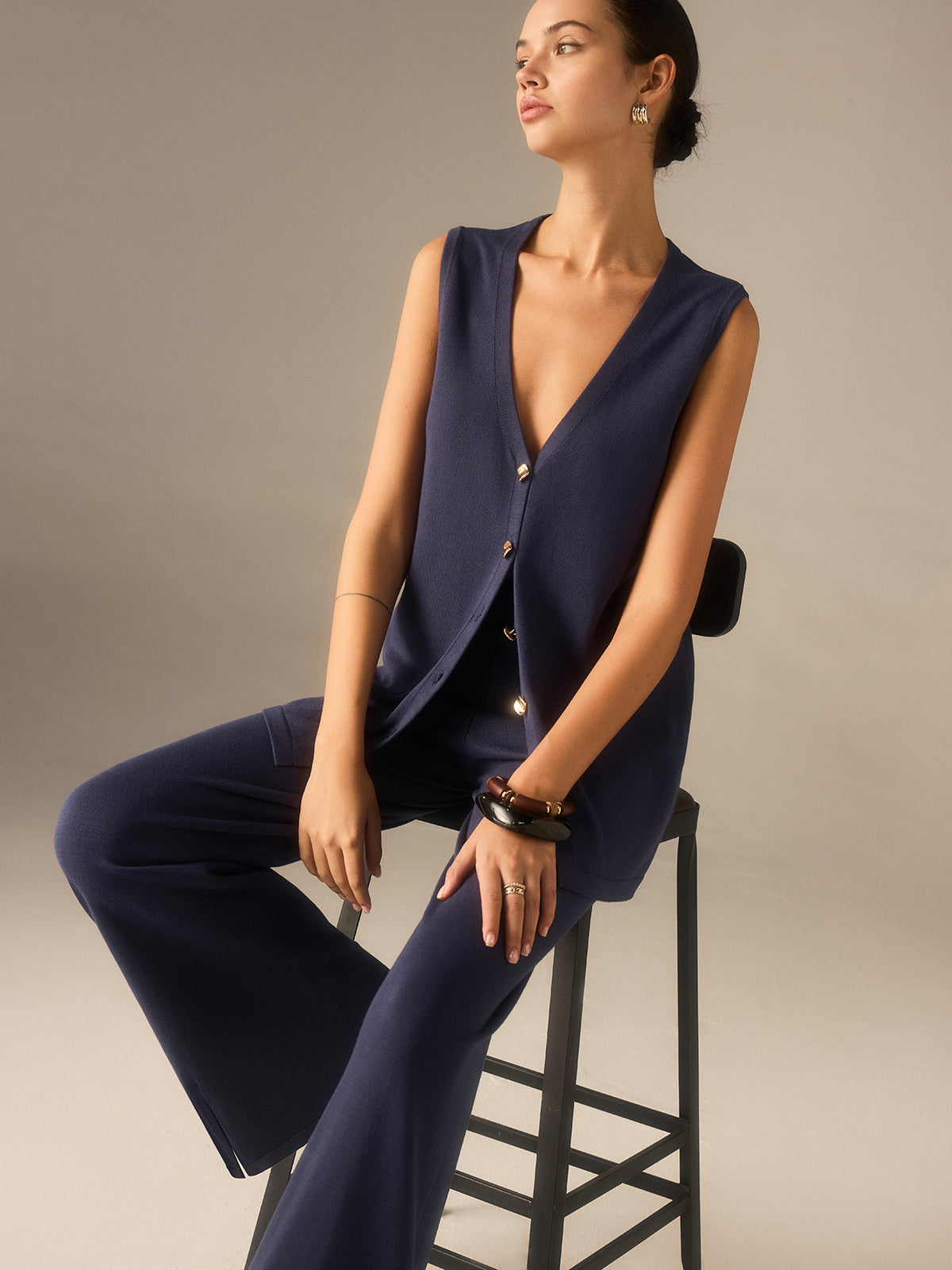 Francine navy longline waistcoat and wide-leg trouser set, seated