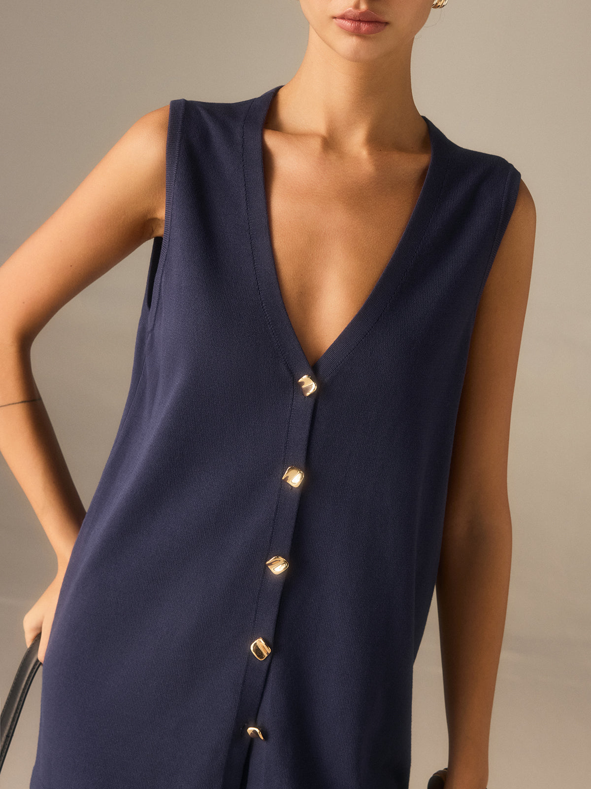 Francine navy waistcoat, close-up of the deep V neckline and gold-tone buttons