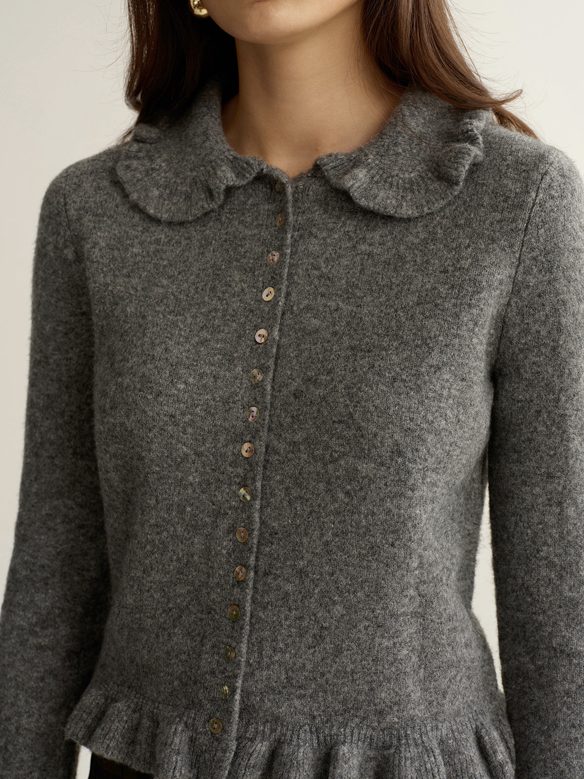 Ginette gray ruffle-collar button cardigan, close-up of the shell-look buttons
