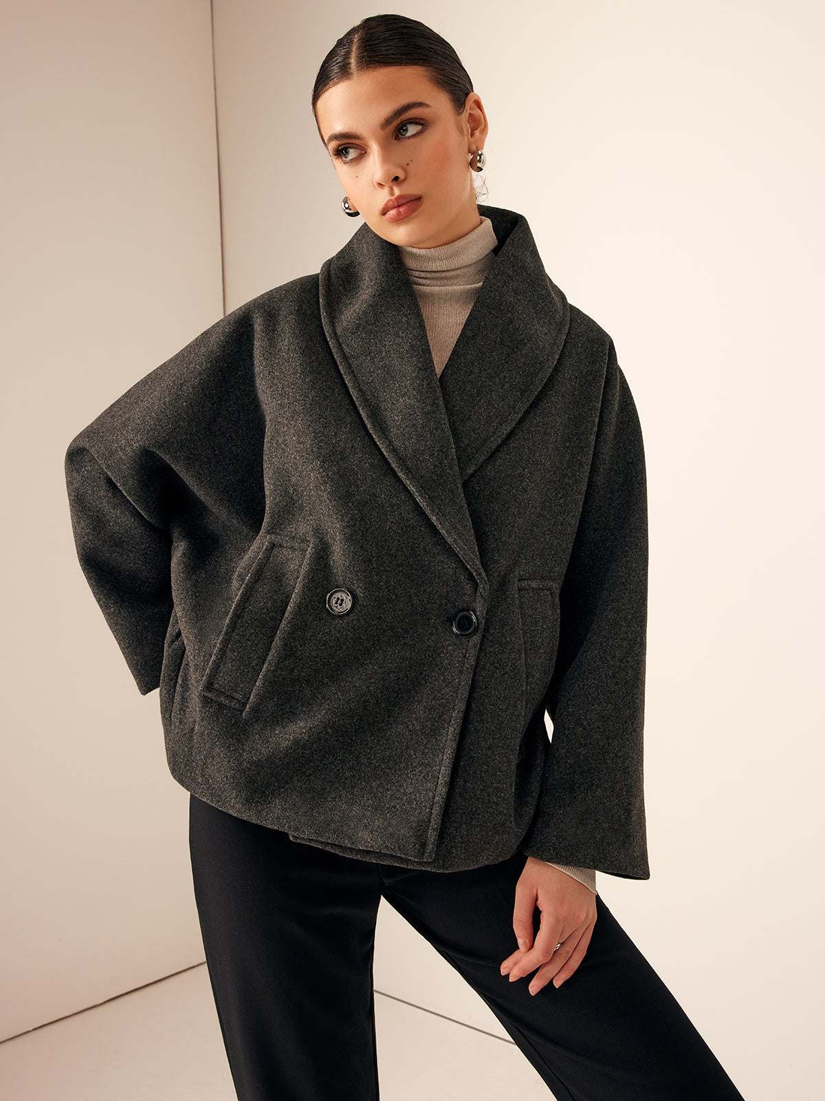 Gray oversized wide-collar jacket fastened at the front, front view