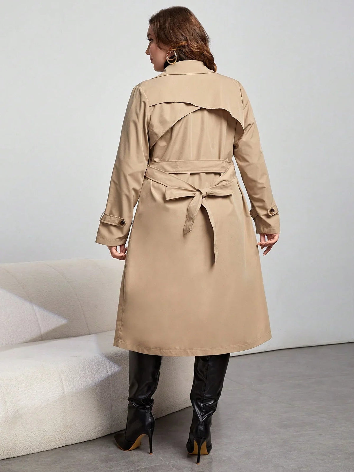 Henriette khaki trench coat, back view showing the storm flap and back belt