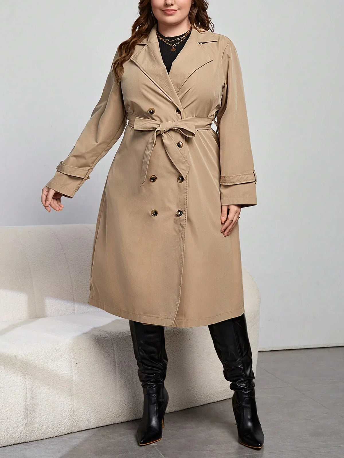Henriette khaki trench coat with the self-tie belt knotted at the waist