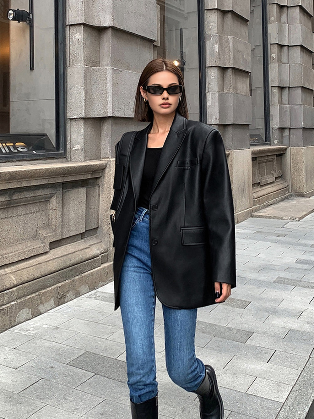 Huguette Black high-shine blazer, full-length view showing the mid-thigh hem