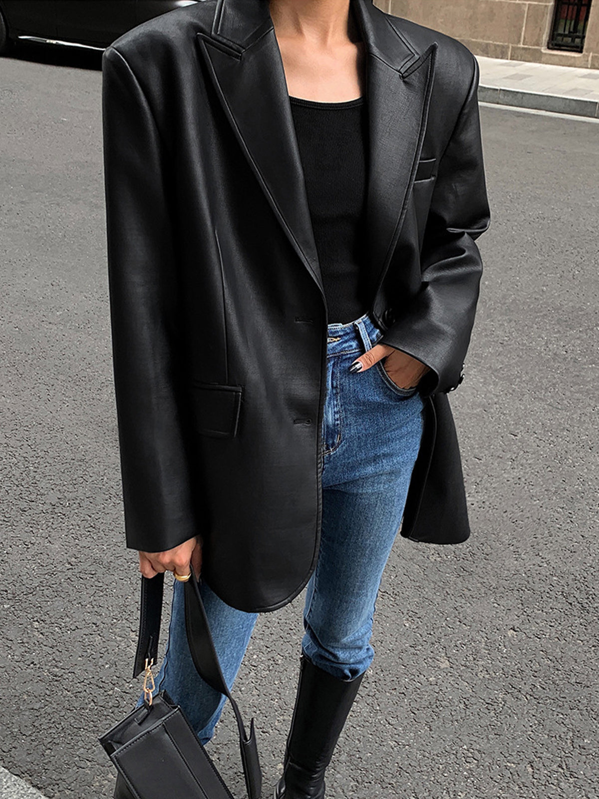 Huguette Black oversized blazer, close-up of the two front buttons and a hip flap pocket
