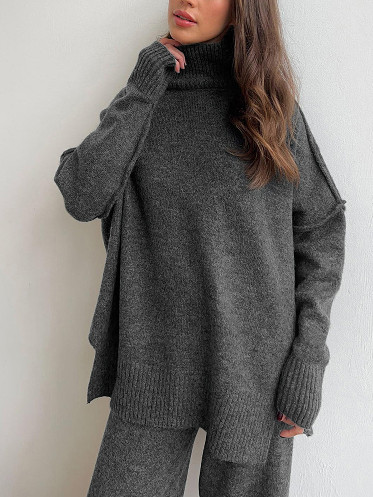 Jacqueline gray knit set showing the high standing neck and long sleeves