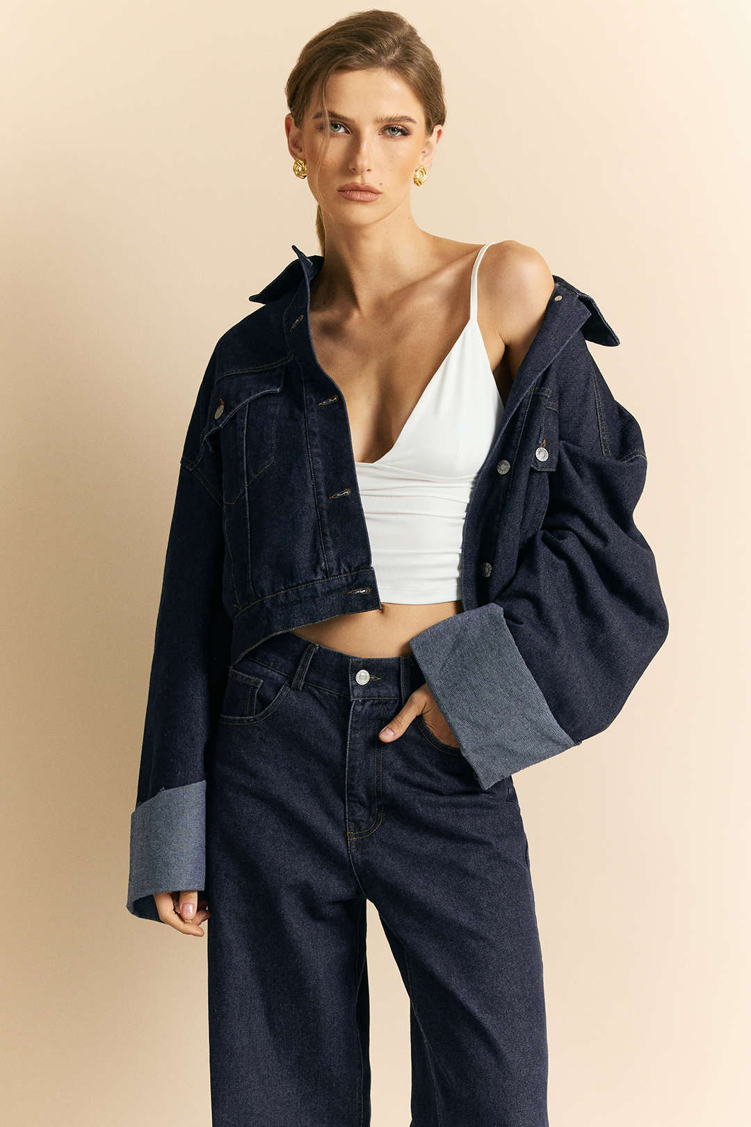 Jeanne blue oversized denim jacket worn off the shoulder, front view