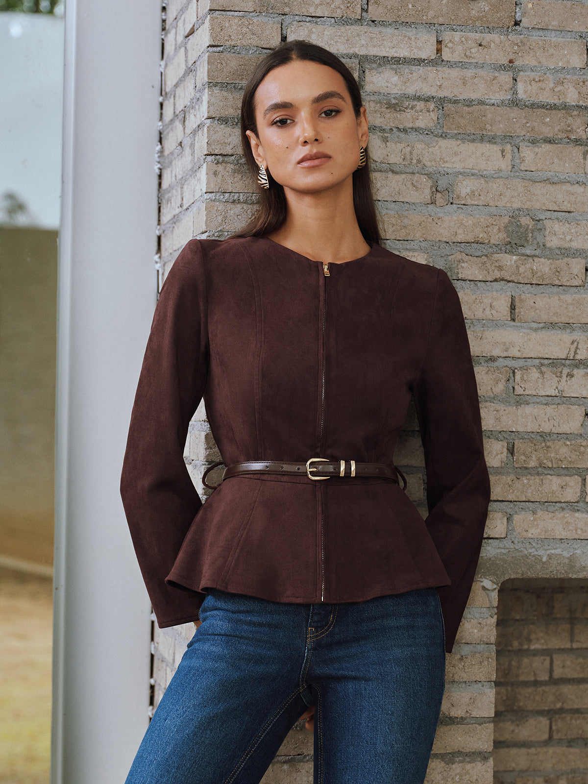 Brown zip-front jacket worn with jeans, front view