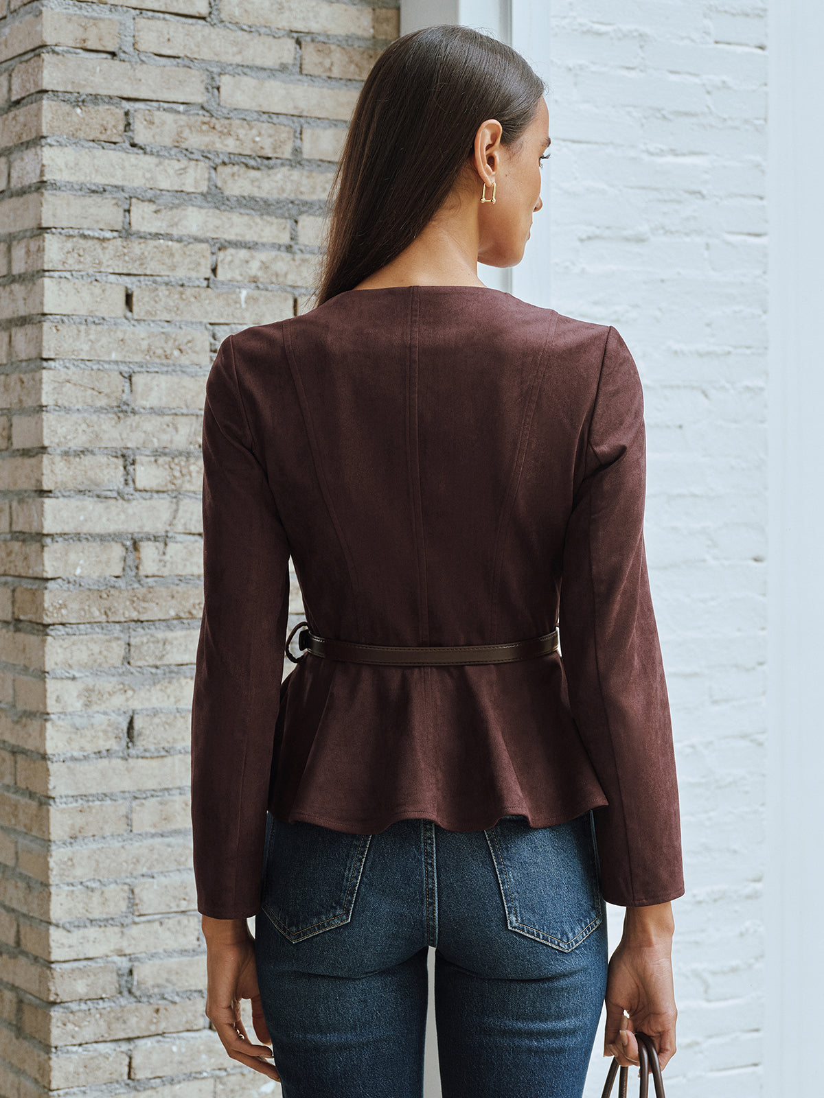 Brown fitted zip-front jacket from the back, showing the seamed waist