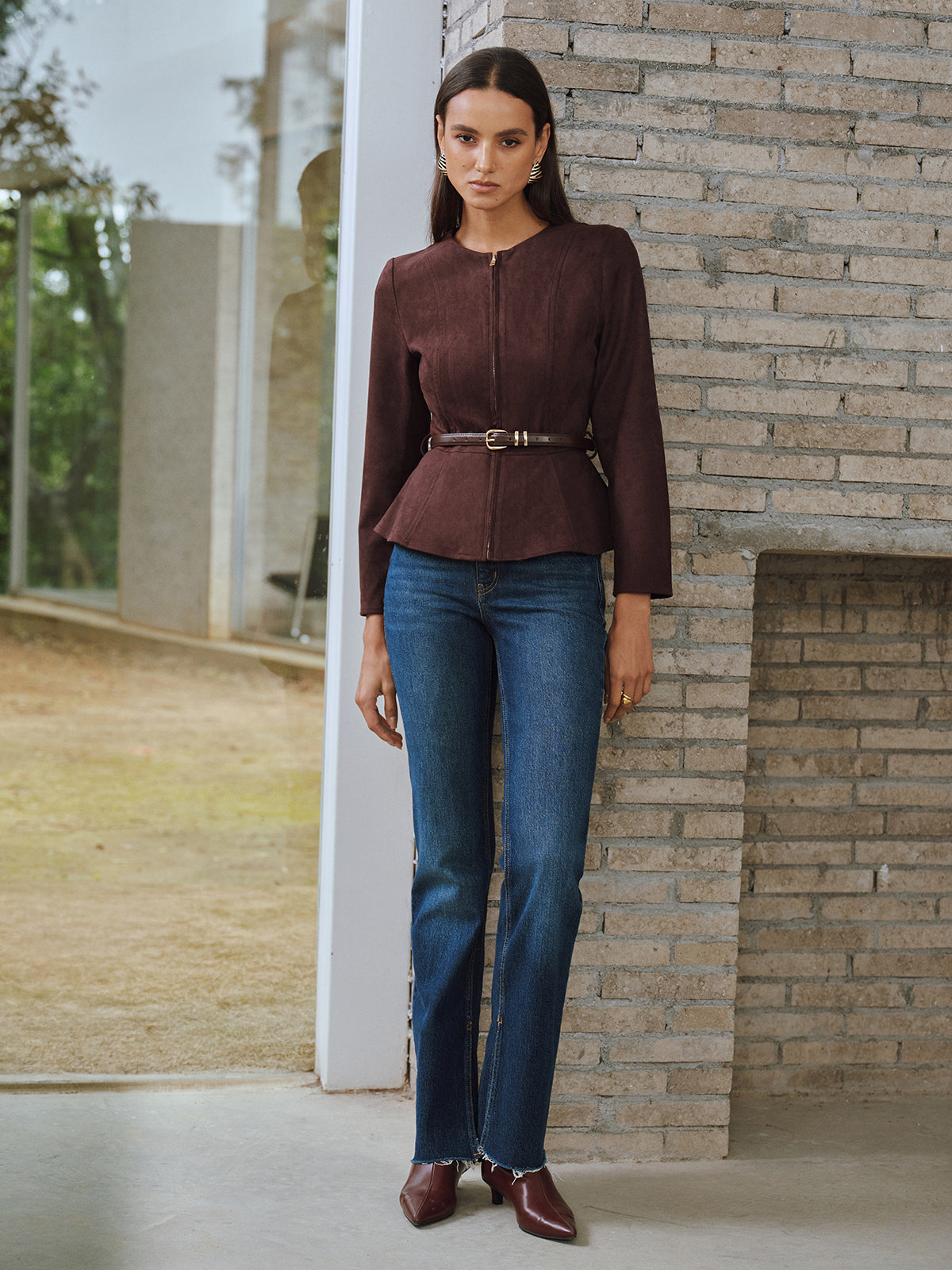 Brown zip-front jacket styled with straight jeans, full-length view