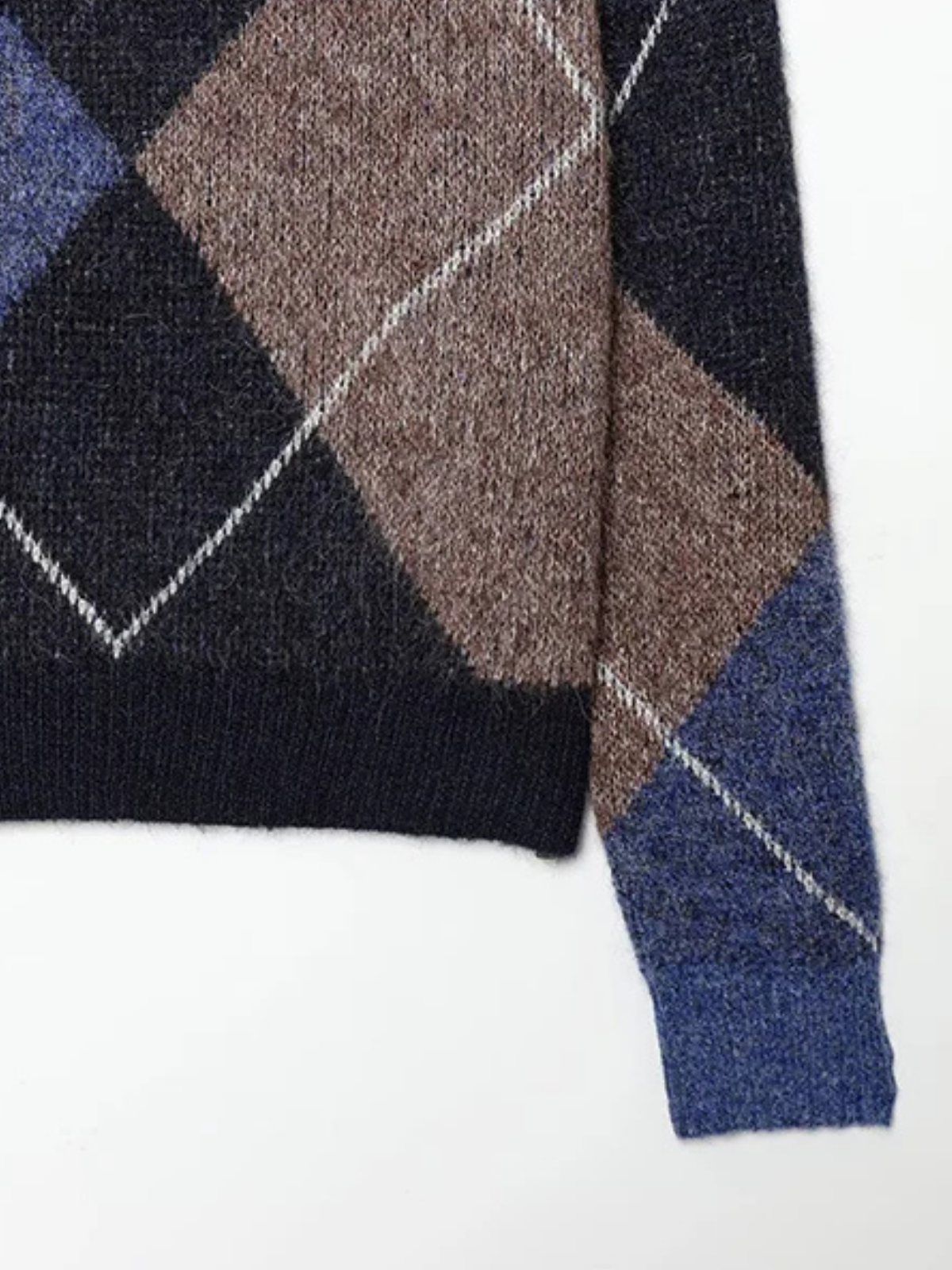 Close-up of the argyle diamonds on the Leonie sweater sleeve