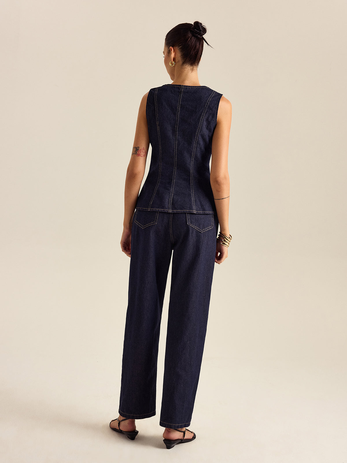 Mahaut indigo denim peplum top and trouser set, back view