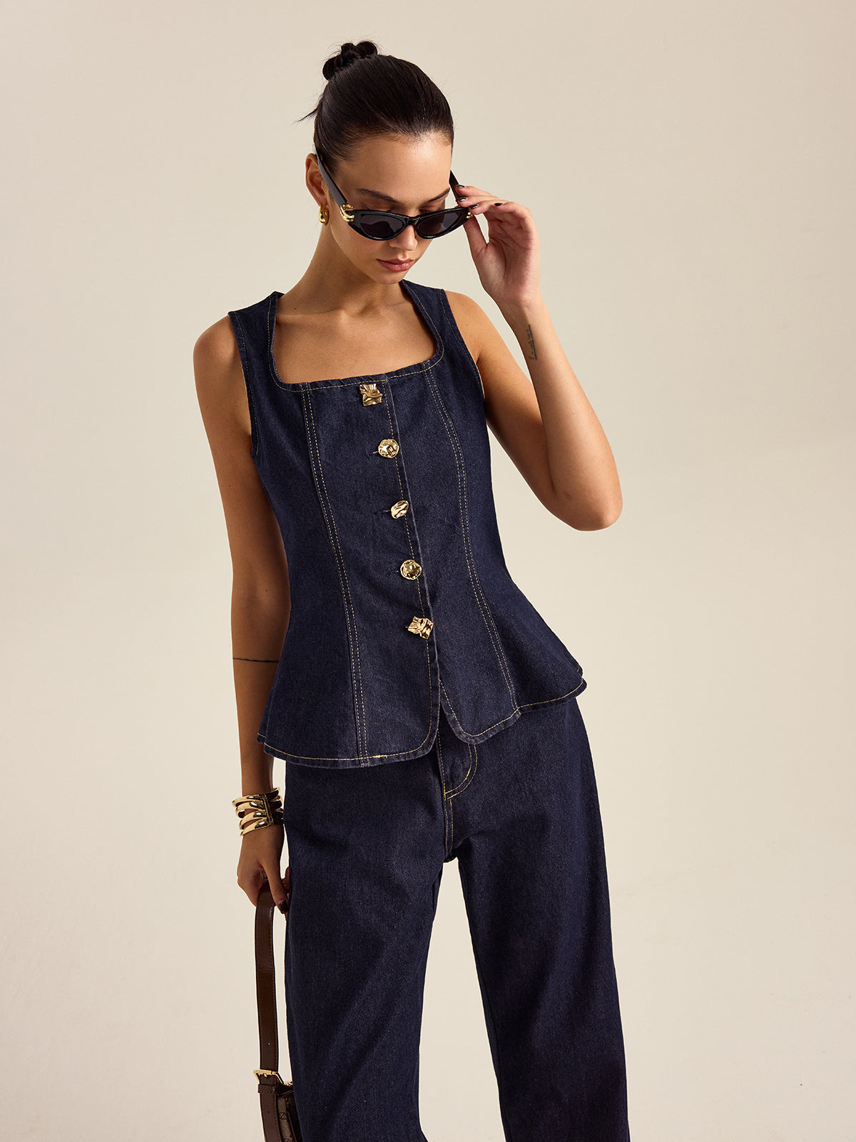 Mahaut indigo denim peplum top and trouser set, three-quarter view