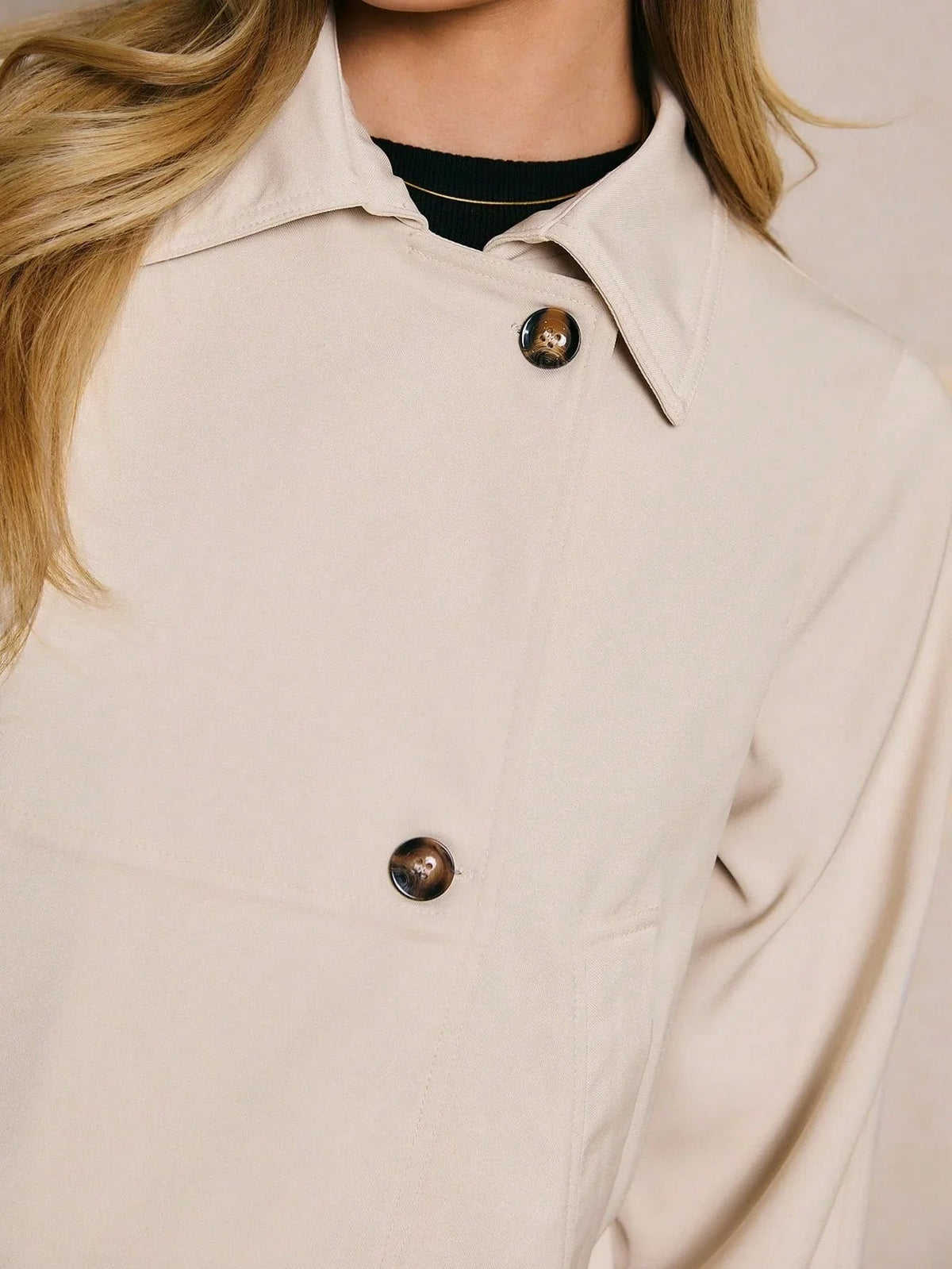 Close-up of the collar and buttons on the Marguerite jacket