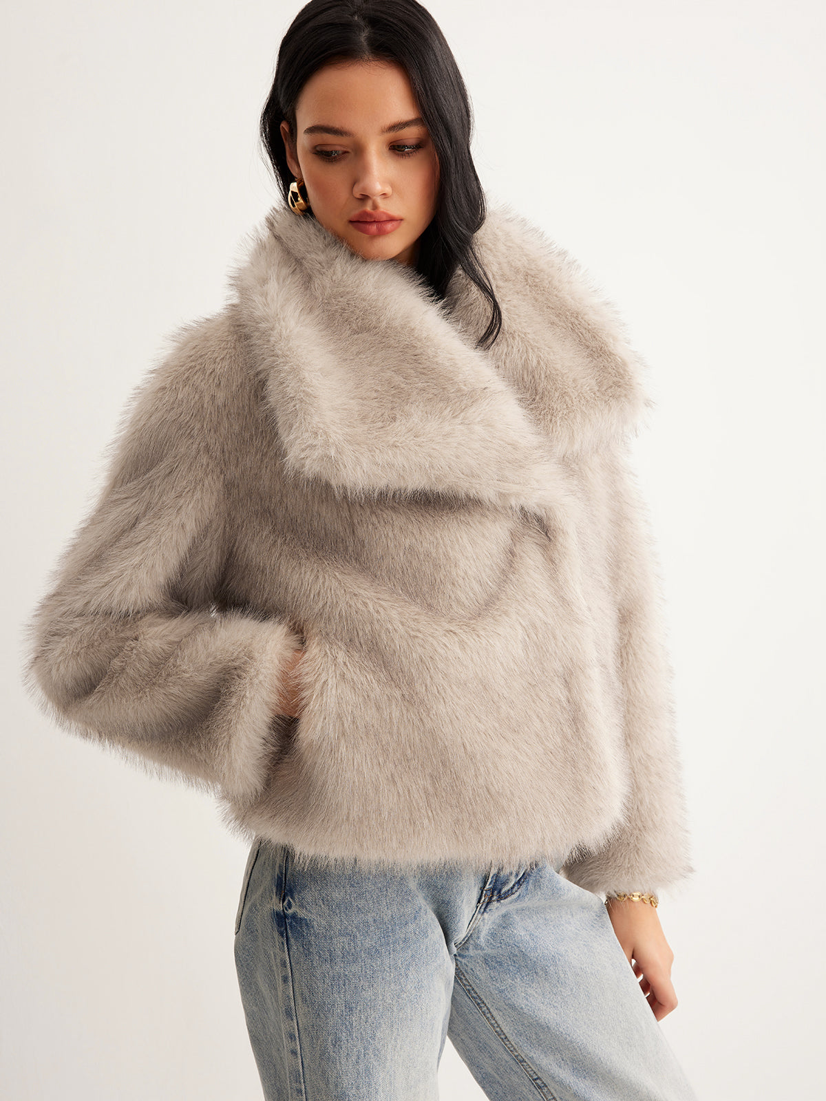 Micheline cream faux fur jacket with wide folded collar, three-quarter front view worn with jeans