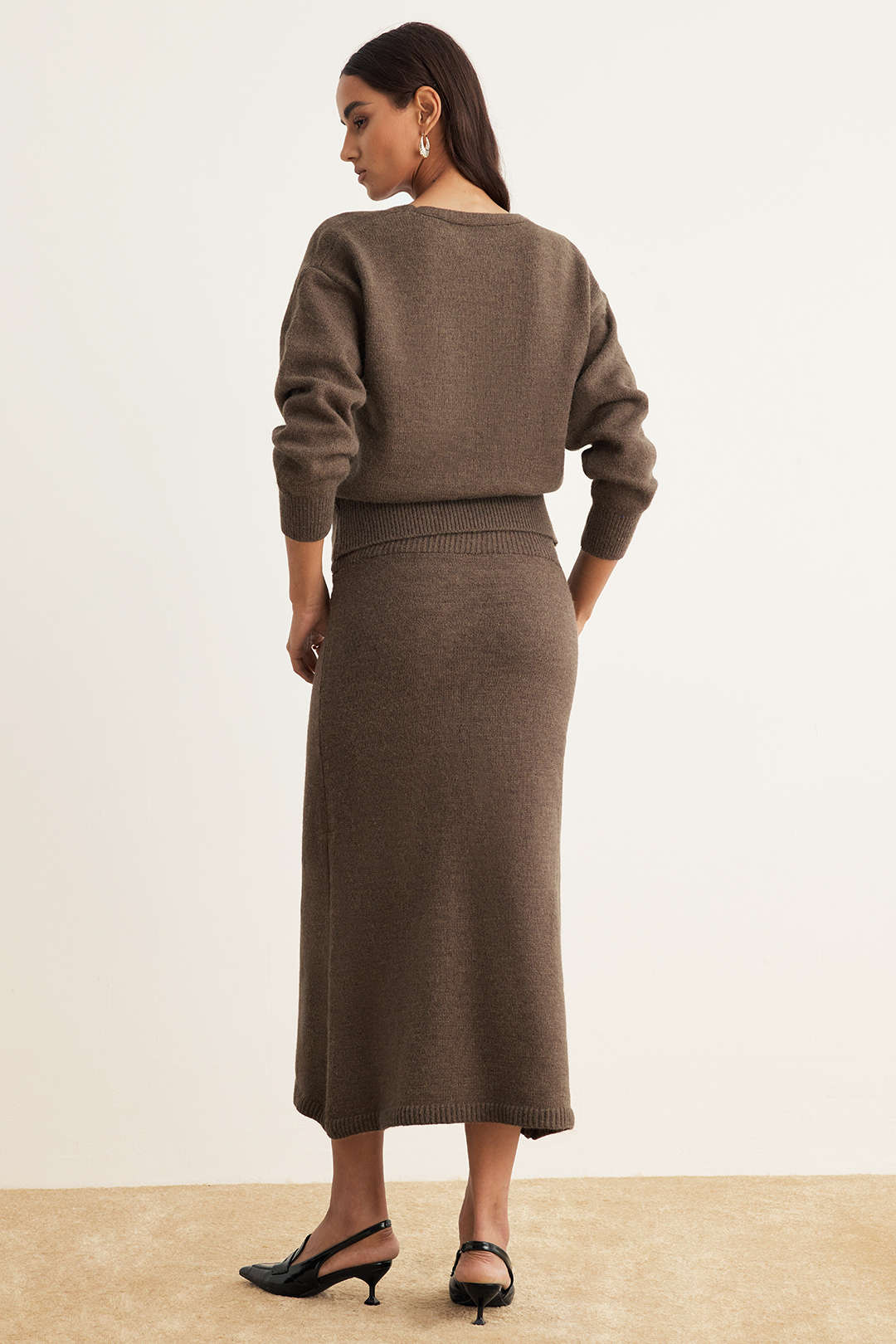 Back view of the brown knit cardigan and midi skirt set