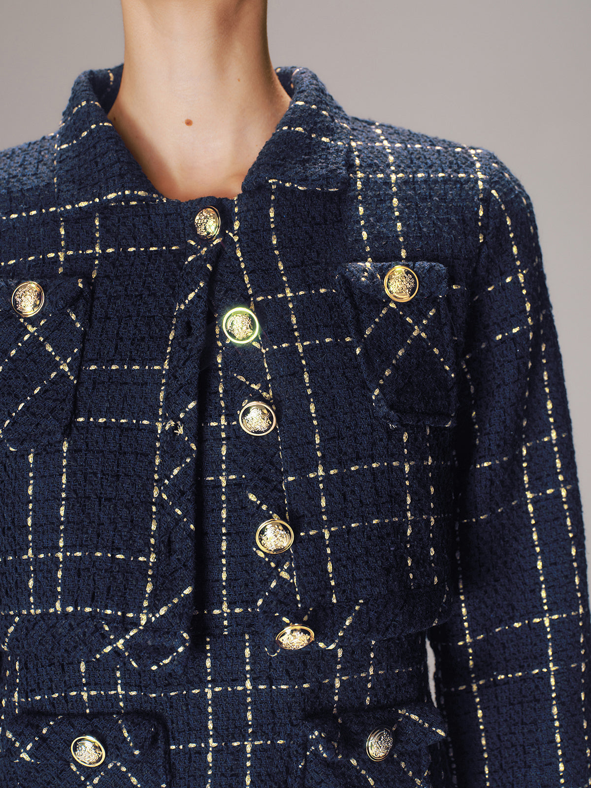Olympe navy gold check tweed set, close-up of the woven check and crest buttons