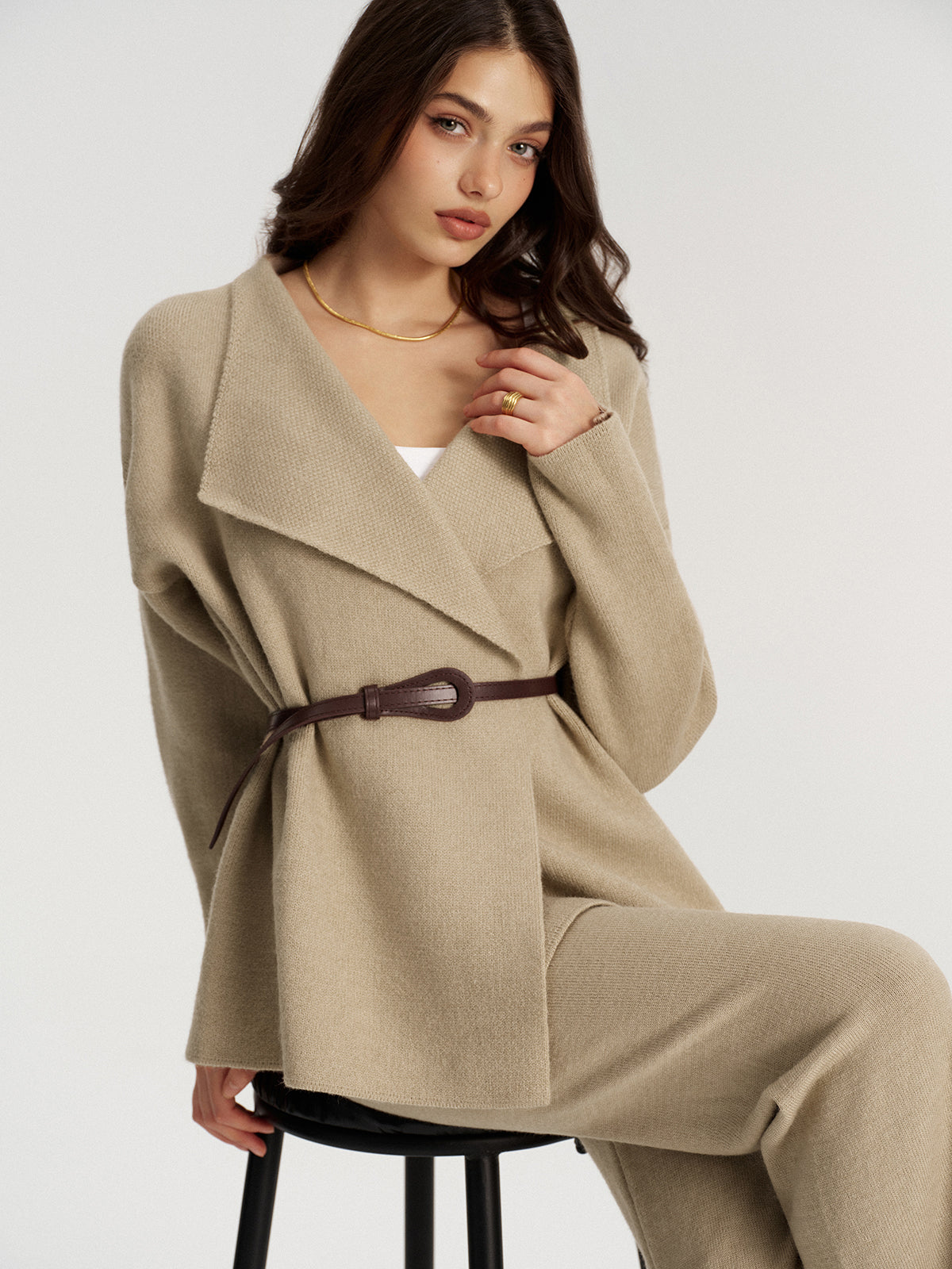 Ombeline sand knit jacket and wide-leg trouser set, three-quarter view seated