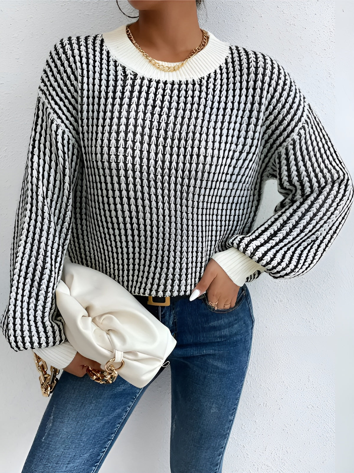 Pierrette black and white striped knit sweater, full front view with the ribbed hem band