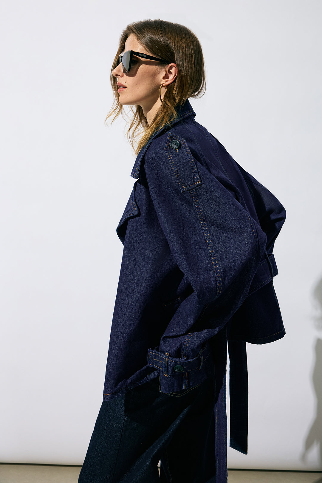 Rachelle blue belted wide-lapel jacket, side view showing the dropped sleeve