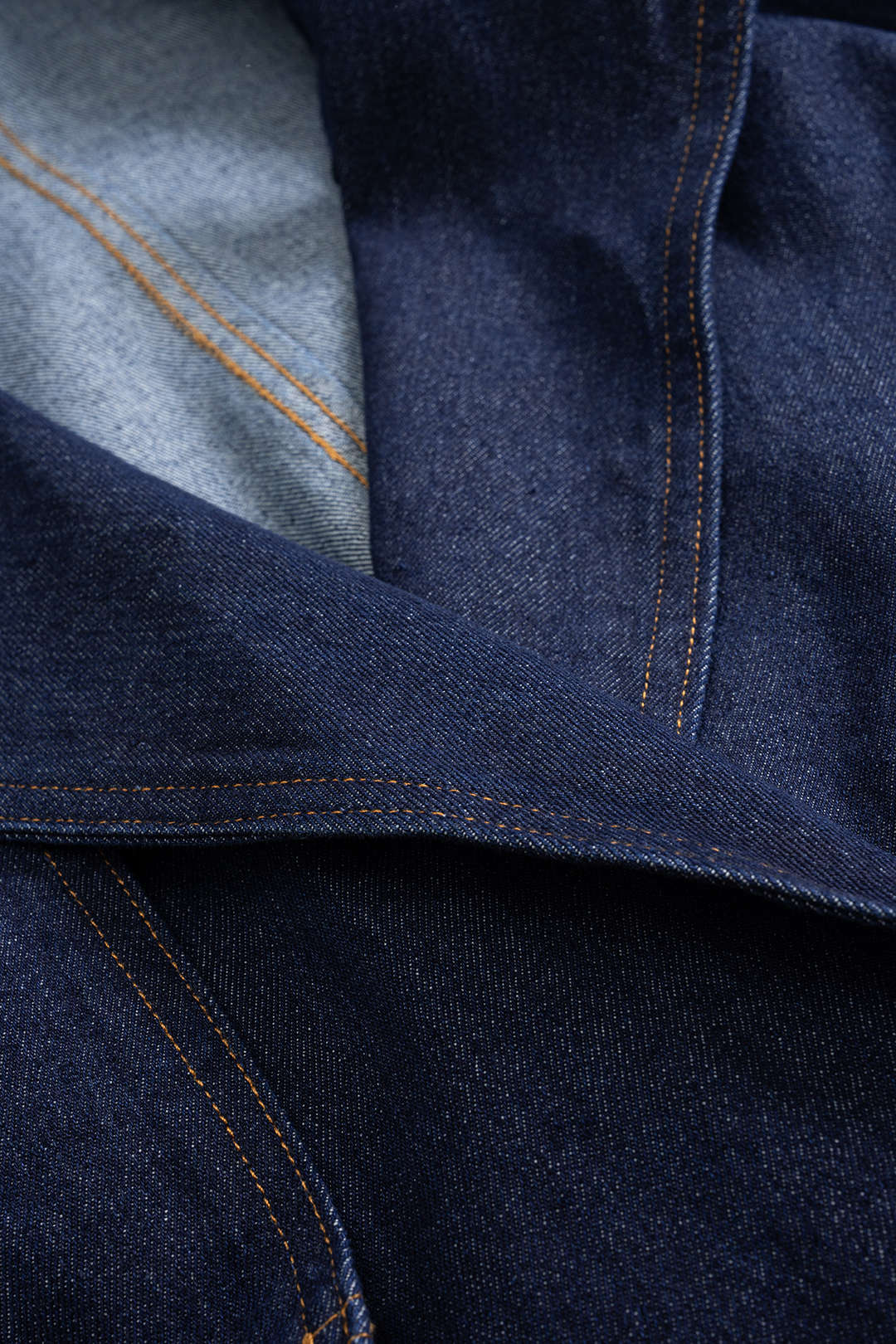 Rachelle blue wide-lapel jacket, close-up of the lapel and topstitching