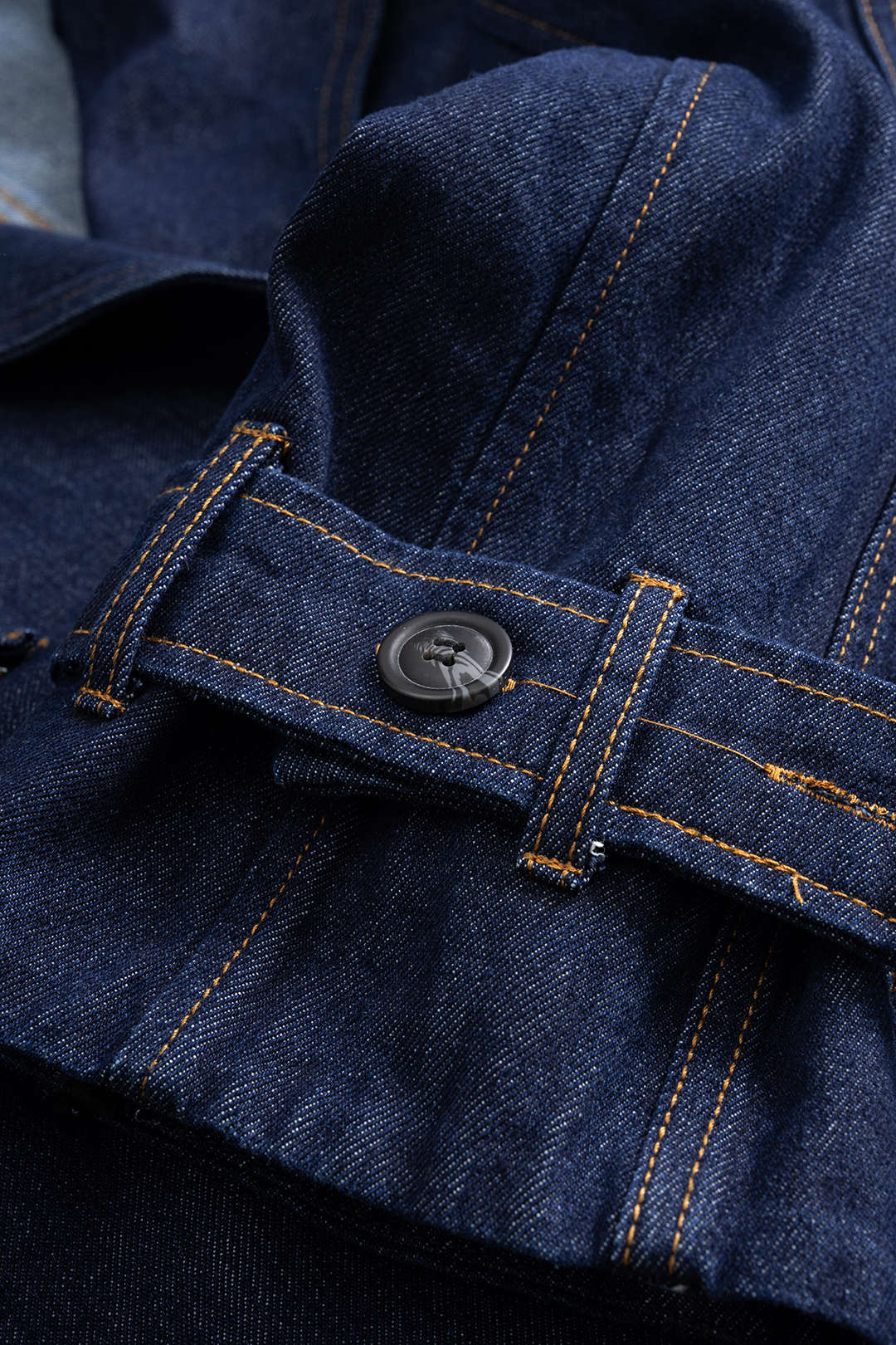 Rachelle blue wide-lapel jacket, close-up of the adjustable cuff