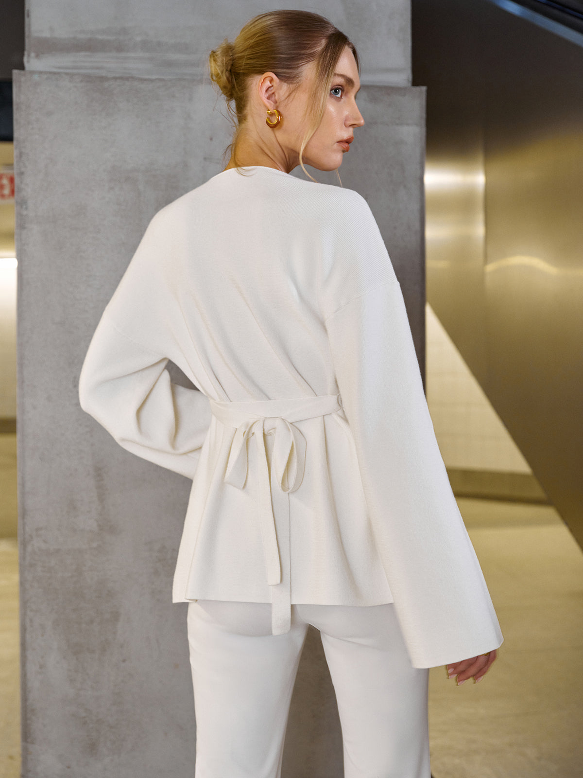 Roseline cream cardigan, back view showing the tie belt knotted in a bow