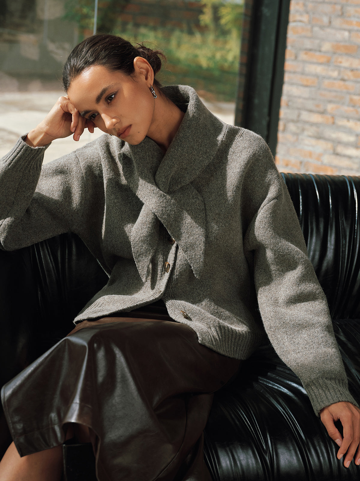 Sandrine gray scarf-tie button cardigan, seated three-quarter front view
