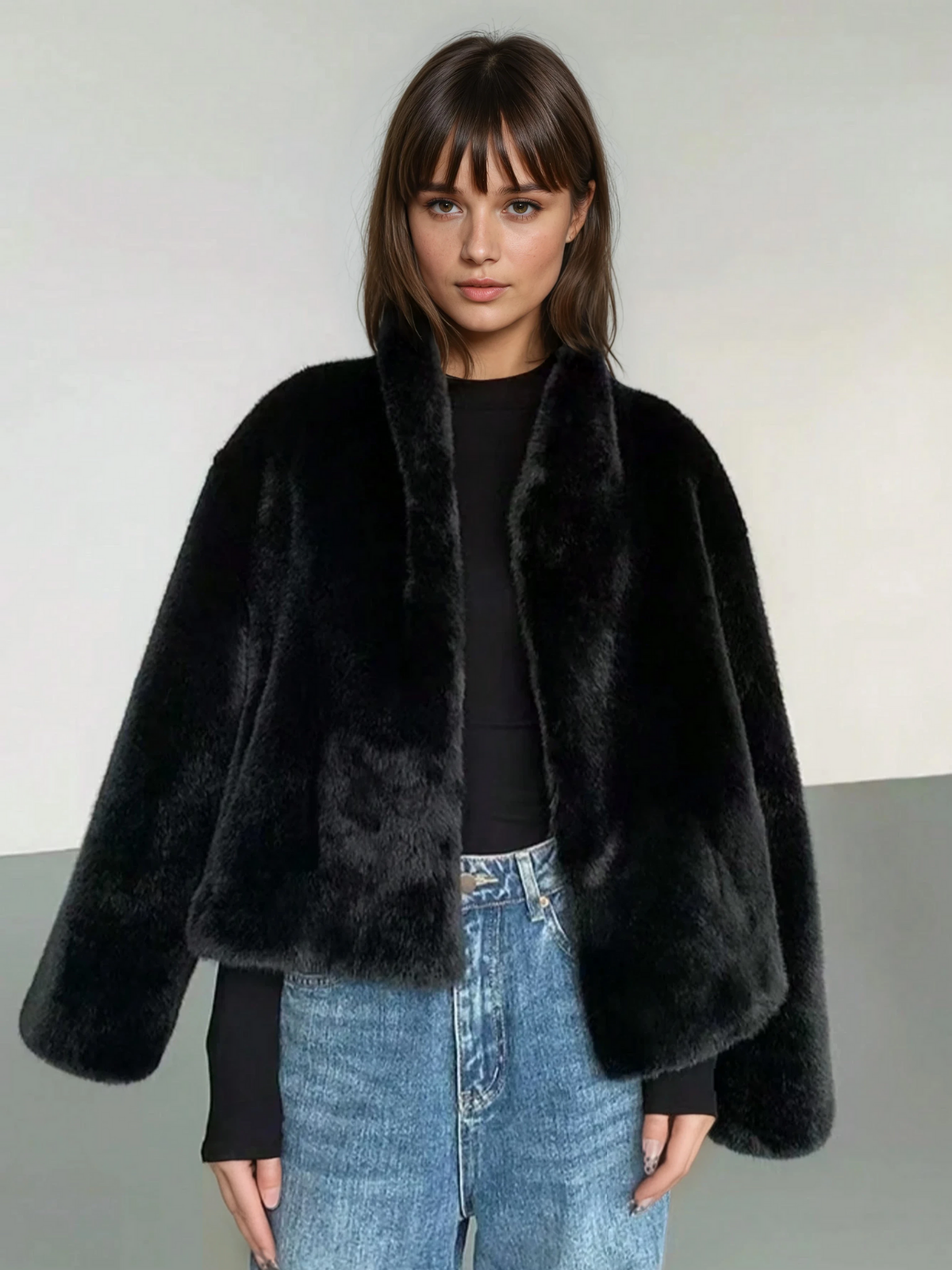 Solange black faux fur short coat worn with jeans