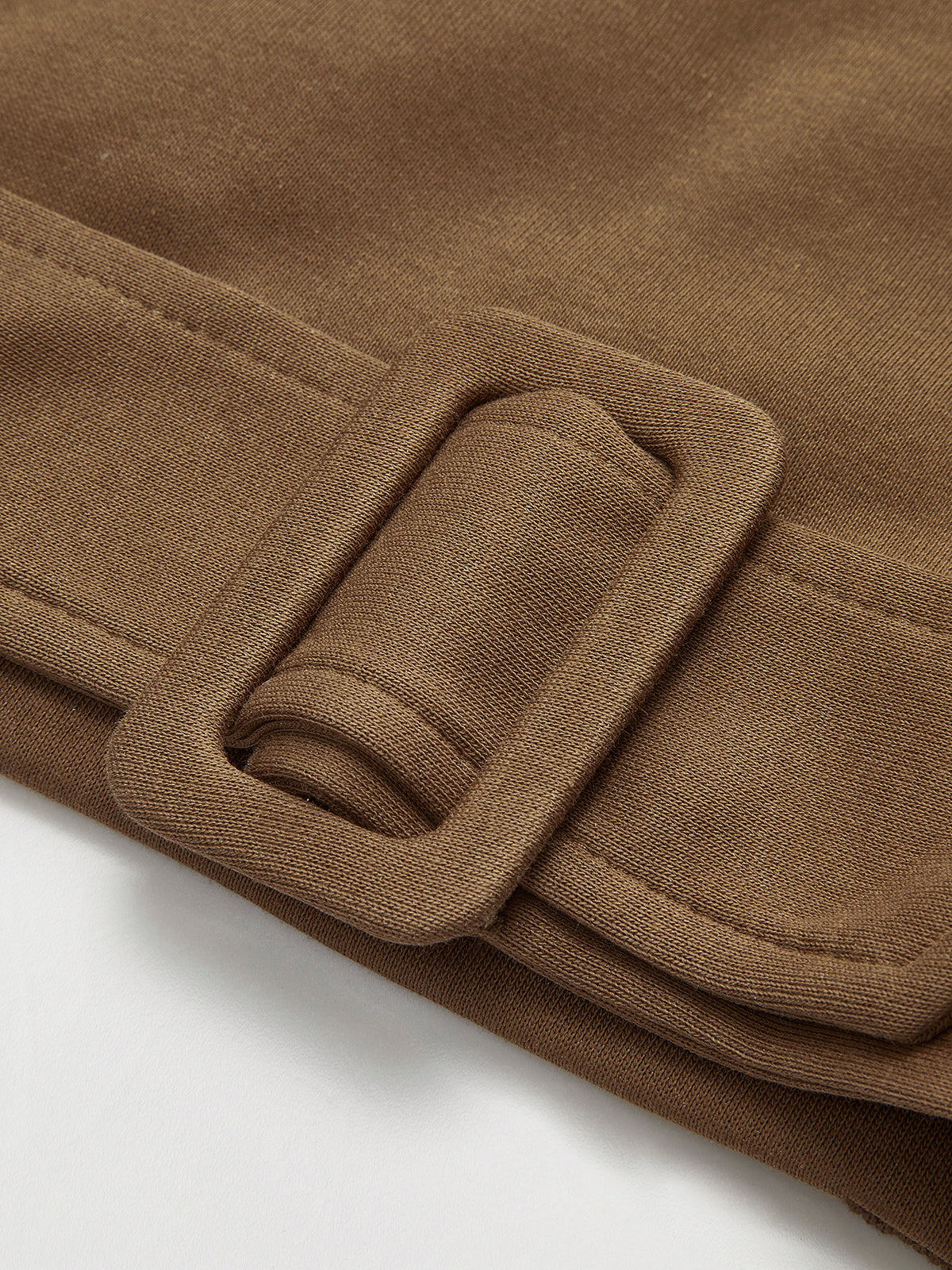 Stephanie brown belted cropped sweatshirt, close-up of the fabric-covered buckle