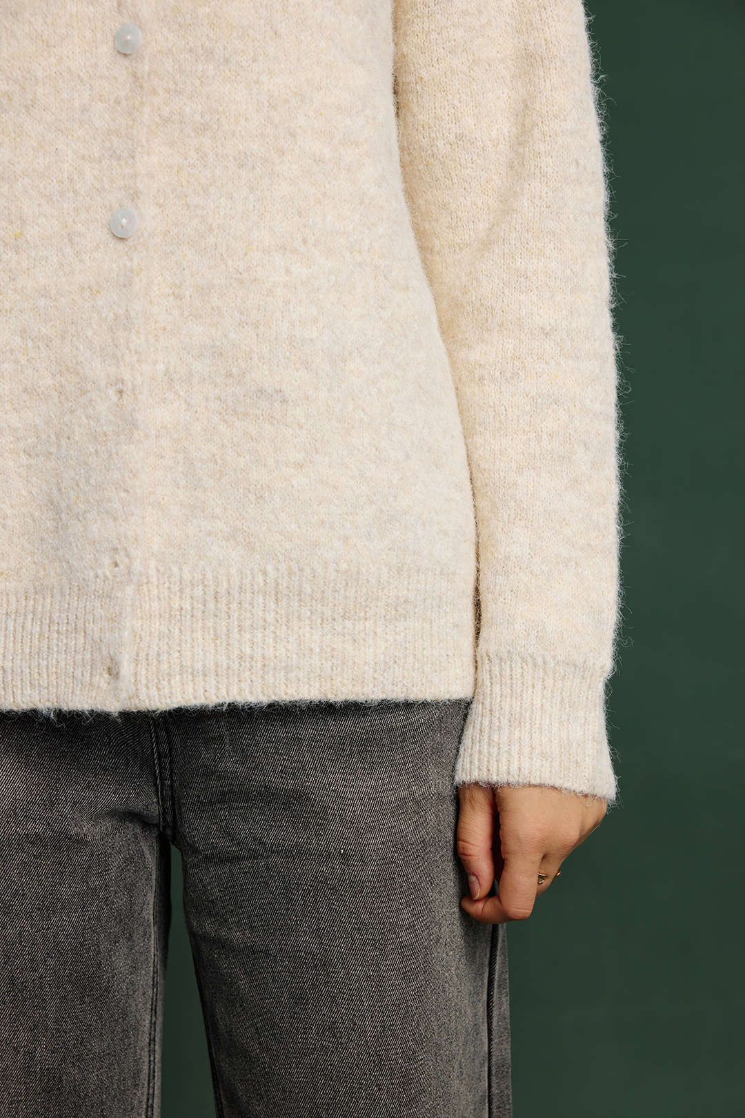 Suzanne cream wool-blend cardigan, close-up of the buttons, ribbed hem and brushed yarn