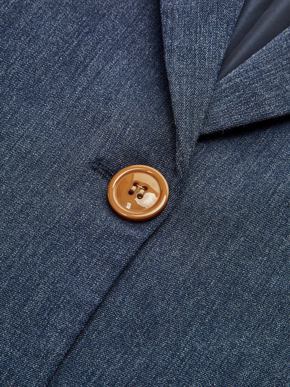Theodora heathered navy blazer, close-up of the contrast tan four-hole button