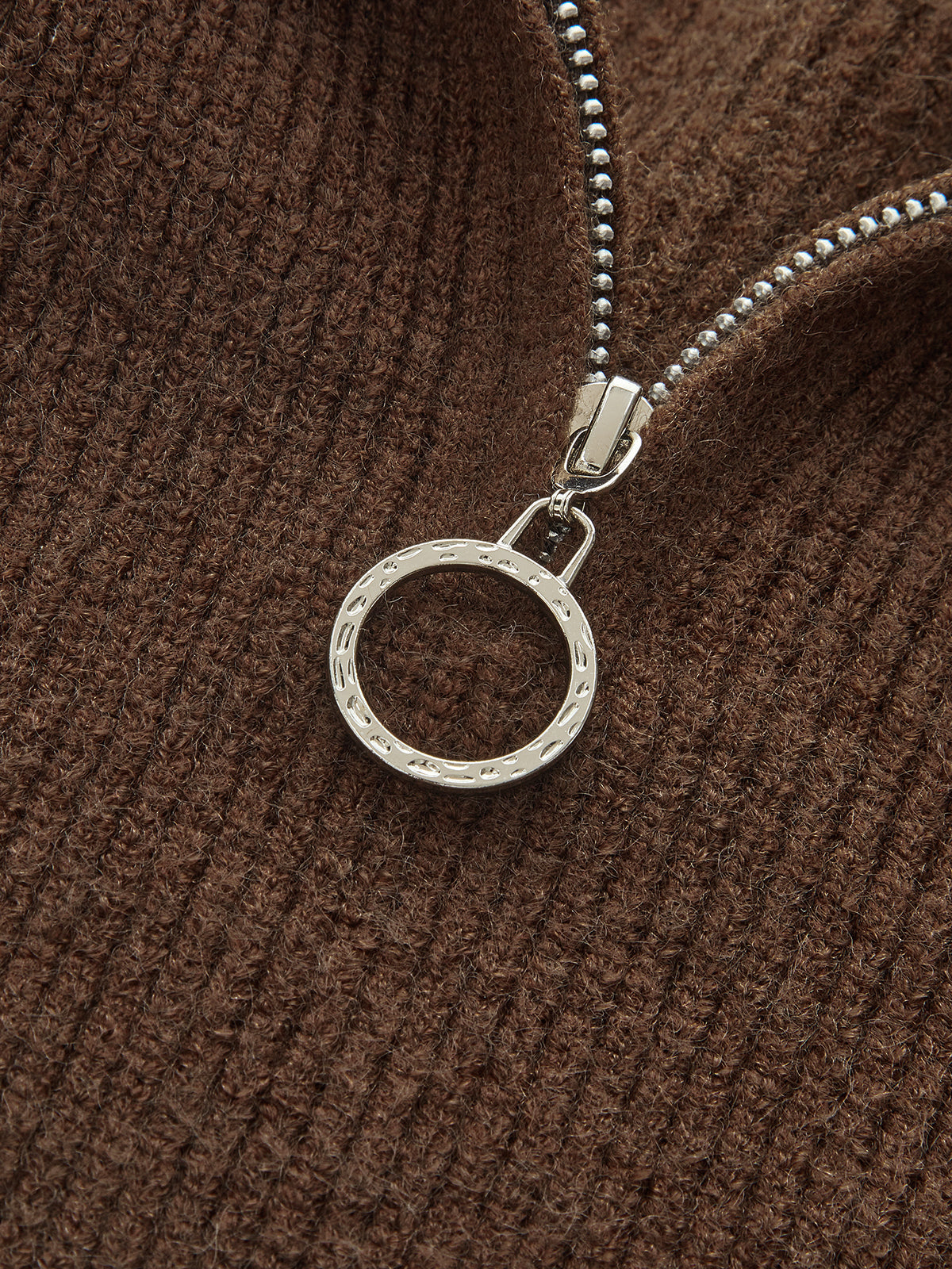Yvette chocolate knit set, close-up of the silver O-ring zip pull